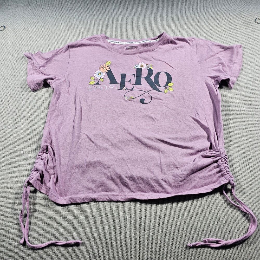 Aéropostale graphic tee features drawstring sides and a "AERO" floral logo